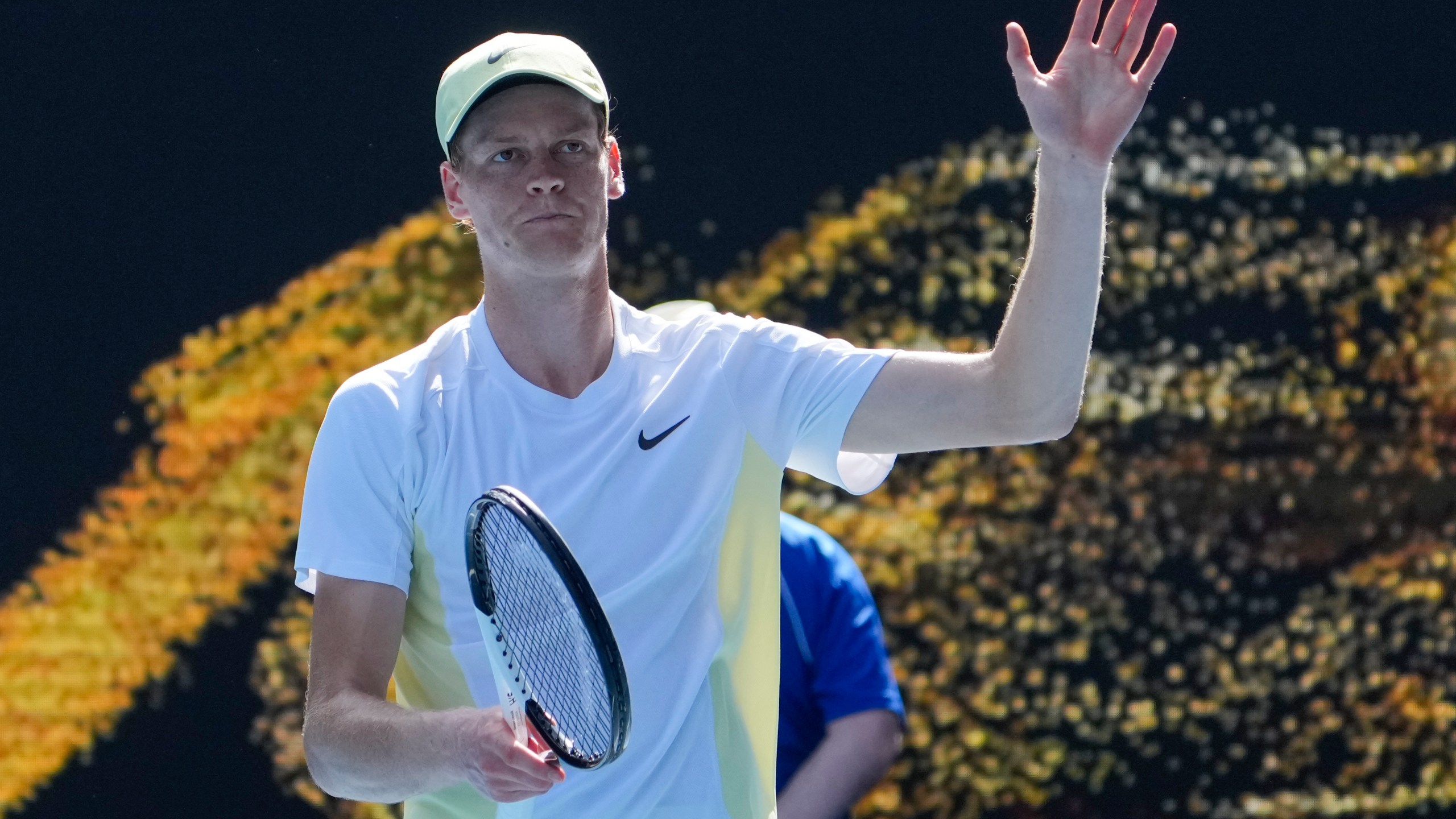 Jannik Sinner of Italy waves after defeating Nicolas Jarry of Chile in their first round match at the Australian Open tennis championship in Melbourne, Australia, Monday, Jan. 13, 2025. (AP Photo/Asanka Brendon Ratnayake)