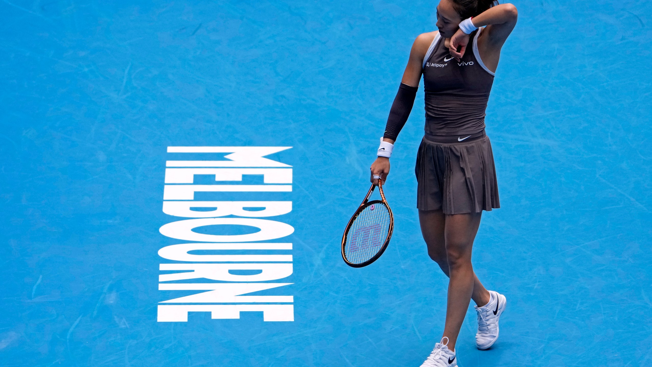 Zheng Qinwen of China reacts during her second round match against Laura Siegemund of Germany at the Australian Open tennis championship in Melbourne, Australia, Wednesday, Jan. 15, 2025. (AP Photo/Asanka Brendon Ratnayake)