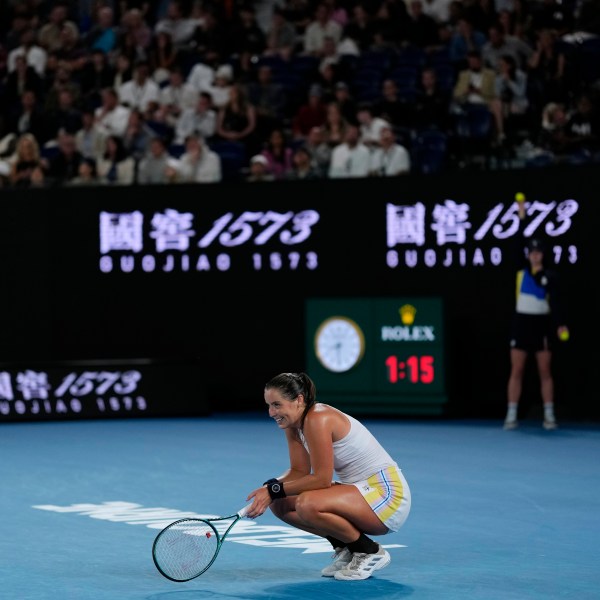 Jodie Burrage of Britain reacts during her second round match against Coco Gauff of the U.S. at the Australian Open tennis championship in Melbourne, Australia, Wednesday, Jan. 15, 2025. (AP Photo/Vincent Thian)