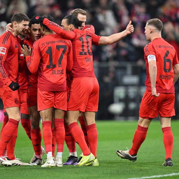 Munich players celebrate Jamal Musiala's goal during the Bundesliga soccer match between Bayern Munich and RB Leipzig at the Allianz Arena, Munich, Germany, Friday Dec. 20, 2024. (Sven Hoppe/dpa via AP)