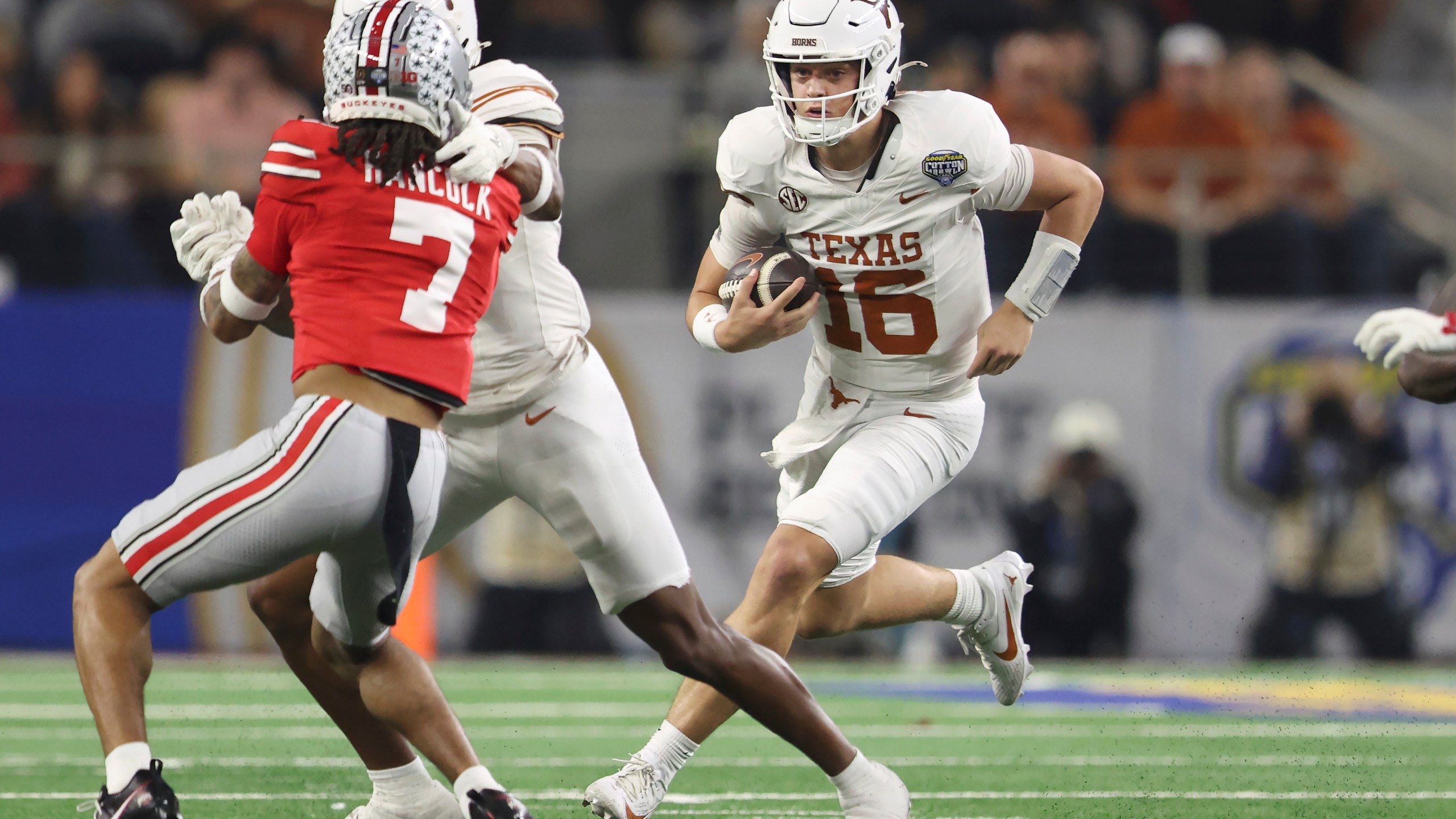 Texas quarterback Arch Manning (16) runs against Ohio State during the first half of the Cotton Bowl College Football Playoff semifinal game, Friday, Jan. 10, 2025, in Arlington, Texas. (AP Photo/Gareth Patterson)