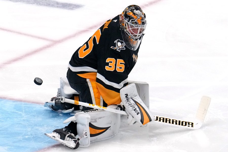 A shot by Seattle Kraken's Chandler Stephenson gets past Pittsburgh Penguins goaltender Tristan Jarry for a goal during the first period of an NHL hockey game in Pittsburgh, Tuesday, Jan. 14, 2025. (AP Photo/Gene J. Puskar)