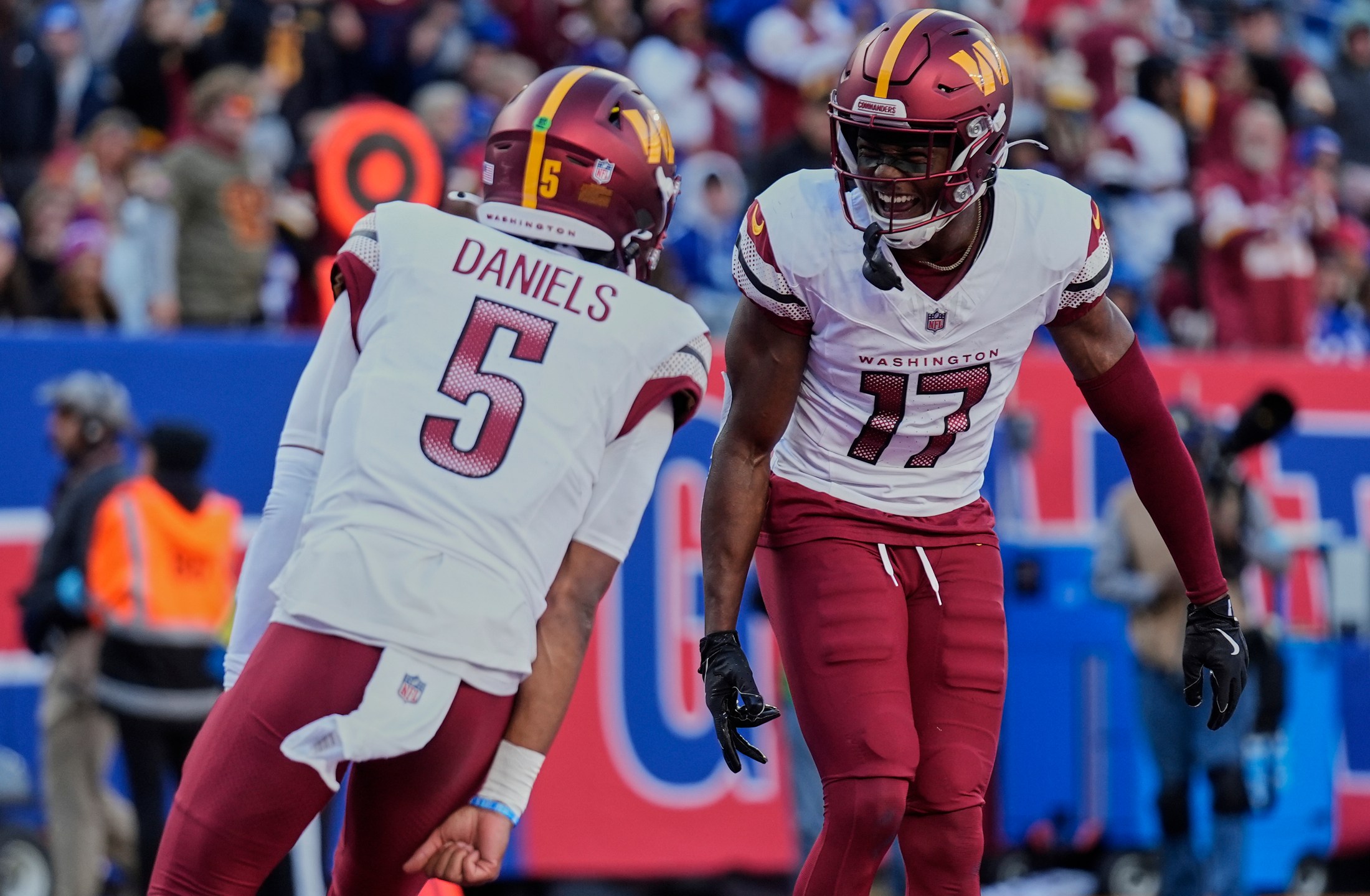 FILE - Washington Commanders wide receiver Terry McLaurin (17) celebrates with quarterback Jayden Daniels (5) after scoring a touchdown against the New York Giants during the second quarter of an NFL football game, Nov. 3, 2024, in East Rutherford, N.J. (AP Photo/Seth Wenig, File)