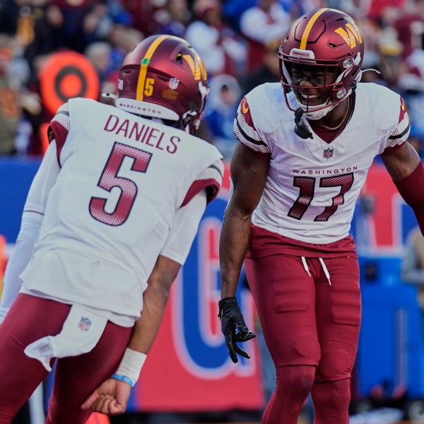 FILE - Washington Commanders wide receiver Terry McLaurin (17) celebrates with quarterback Jayden Daniels (5) after scoring a touchdown against the New York Giants during the second quarter of an NFL football game, Nov. 3, 2024, in East Rutherford, N.J. (AP Photo/Seth Wenig, File)