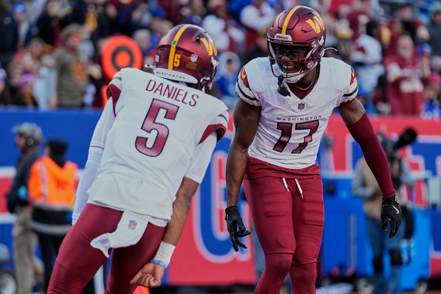 FILE - Washington Commanders wide receiver Terry McLaurin (17) celebrates with quarterback Jayden Daniels (5) after scoring a touchdown against the New York Giants during the second quarter of an NFL football game, Nov. 3, 2024, in East Rutherford, N.J. (AP Photo/Seth Wenig, File)