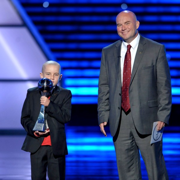 FILE - Jack Hoffman, left, accepts the award for best moment at the ESPY Awards, July 17, 2013, at Nokia Theater in Los Angeles. At right is Andy Hoffman. (Photo by John Shearer/Invision/AP, File)