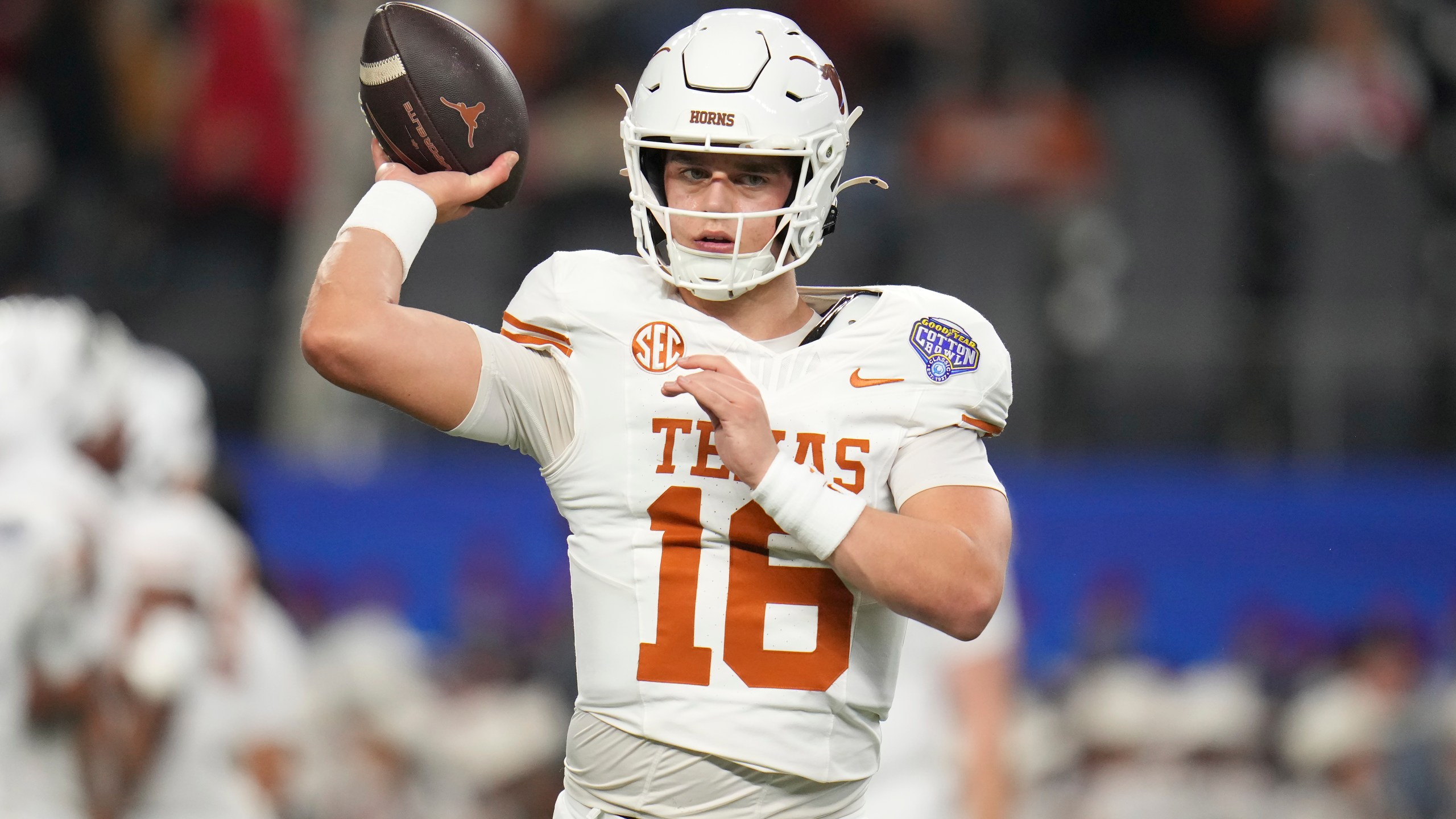 Texas quarterback Arch Manning warms up before the Cotton Bowl College Football Playoff semifinal game against Ohio State, Friday, Jan. 10, 2025, in Arlington, Texas. (AP Photo/Julio Cortez)