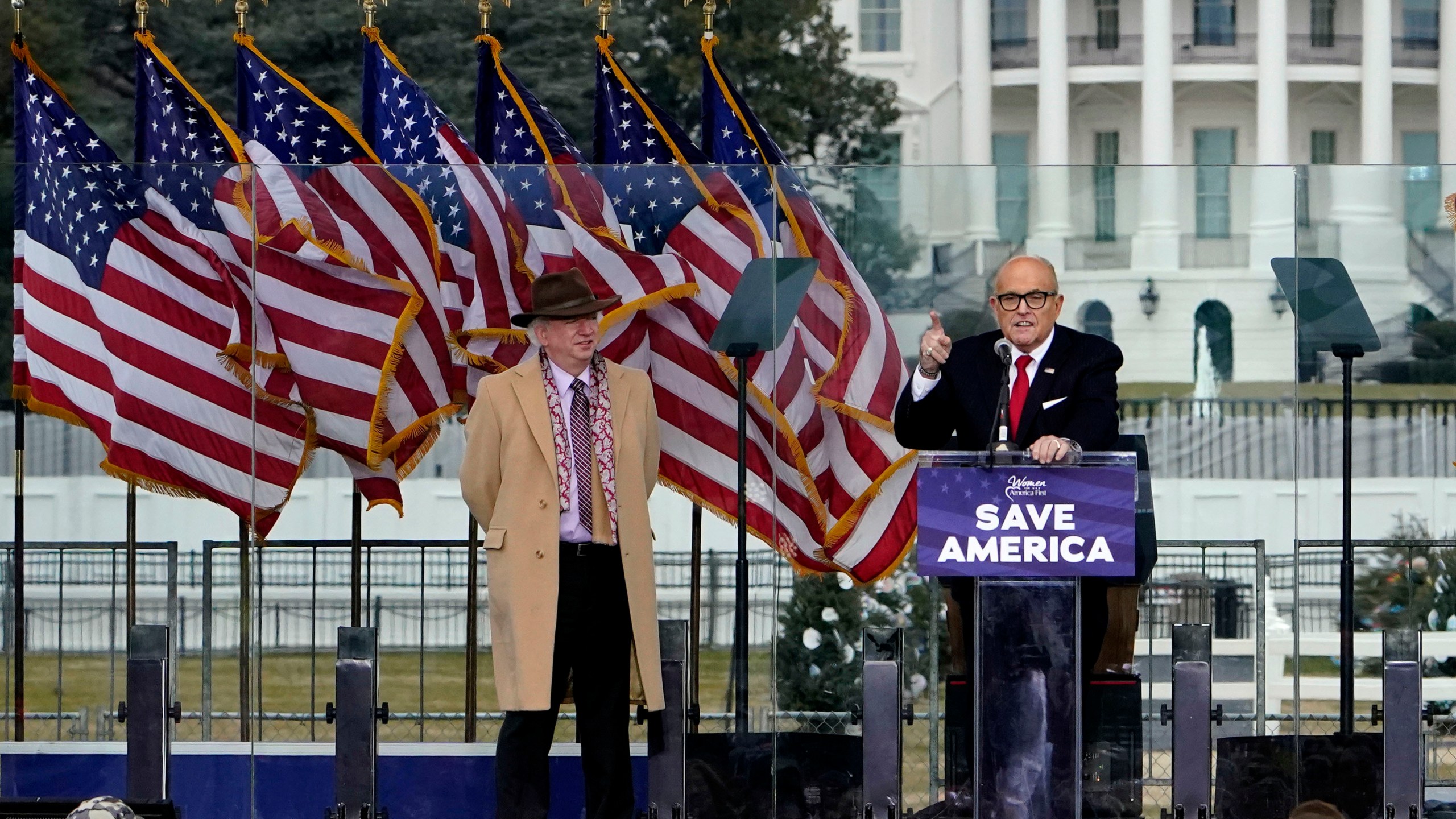 FILE - Chapman University law professor John Eastman stands at left as former New York Mayor Rudolph Giuliani speaks in Washington at a rally in support of President Donald Trump, called the "Save America Rally" on Jan. 6, 2021. (AP Photo/Jacquelyn Martin, File)