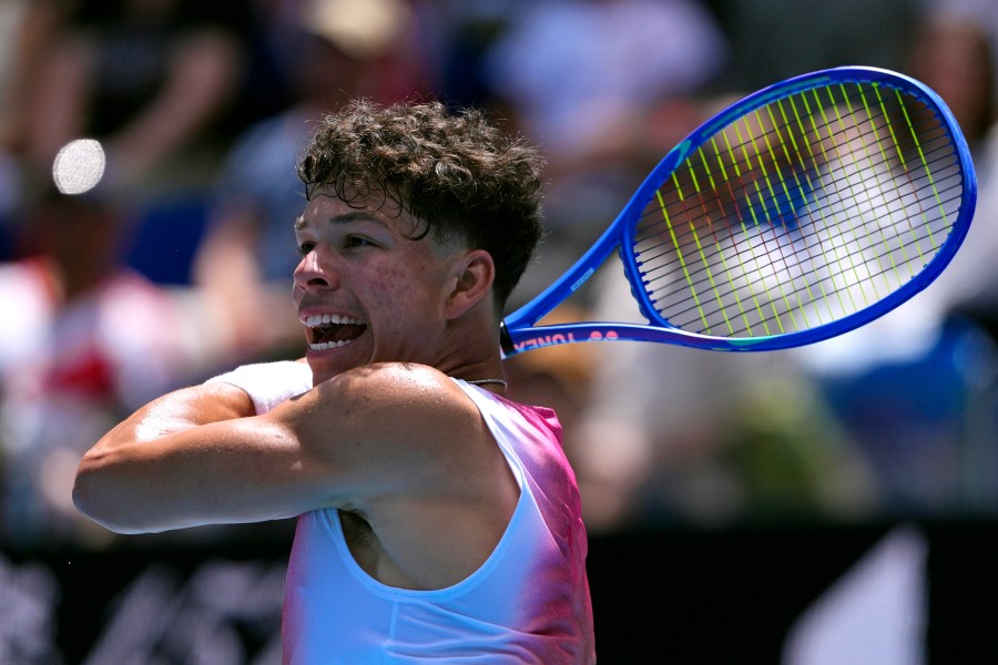 Ben Shelton of the U.S. plays a forehand return to Pablo Carreno Busta of Spain during their second round match at the Australian Open tennis championship in Melbourne, Australia, Thursday, Jan. 16, 2025. (AP Photo/Vincent Thian)