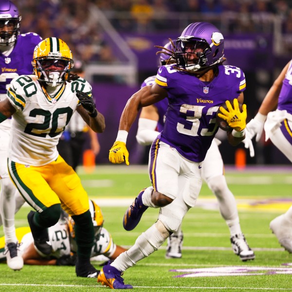 Minnesota Vikings' Aaron Jones runs during the second half of an NFL football game against the Green Bay Packers Sunday, Dec. 29, 2024, in Minneapolis. (AP Photo/Bruce Kluckhohn)