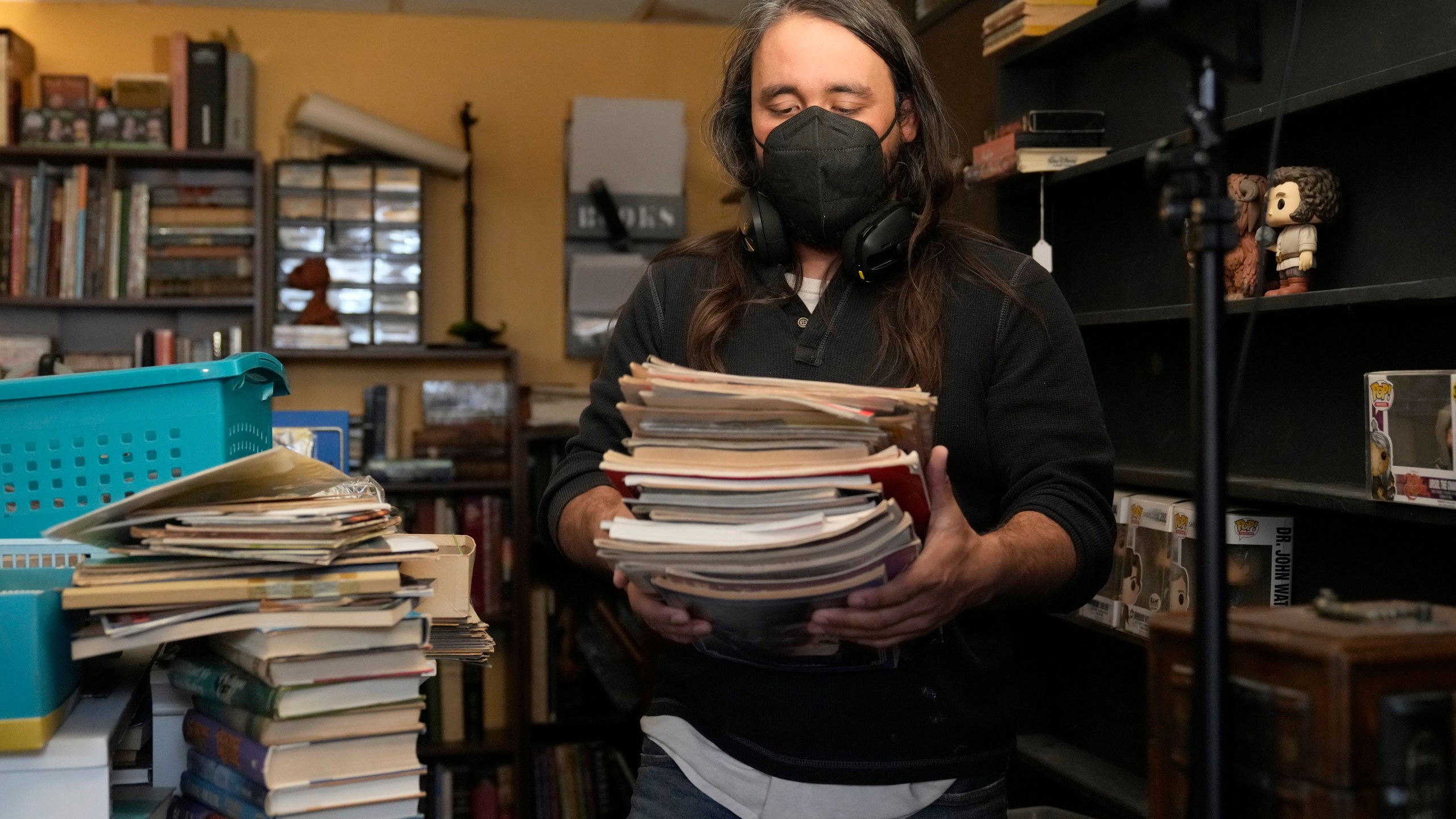 Steve Alejandro works in his office near the room where his wife, Ashley, spends most of her time due to illness in the basement of their home Wednesday, Dec. 18, 2024, in Wentzville, Mo. (AP Photo/Jeff Roberson)