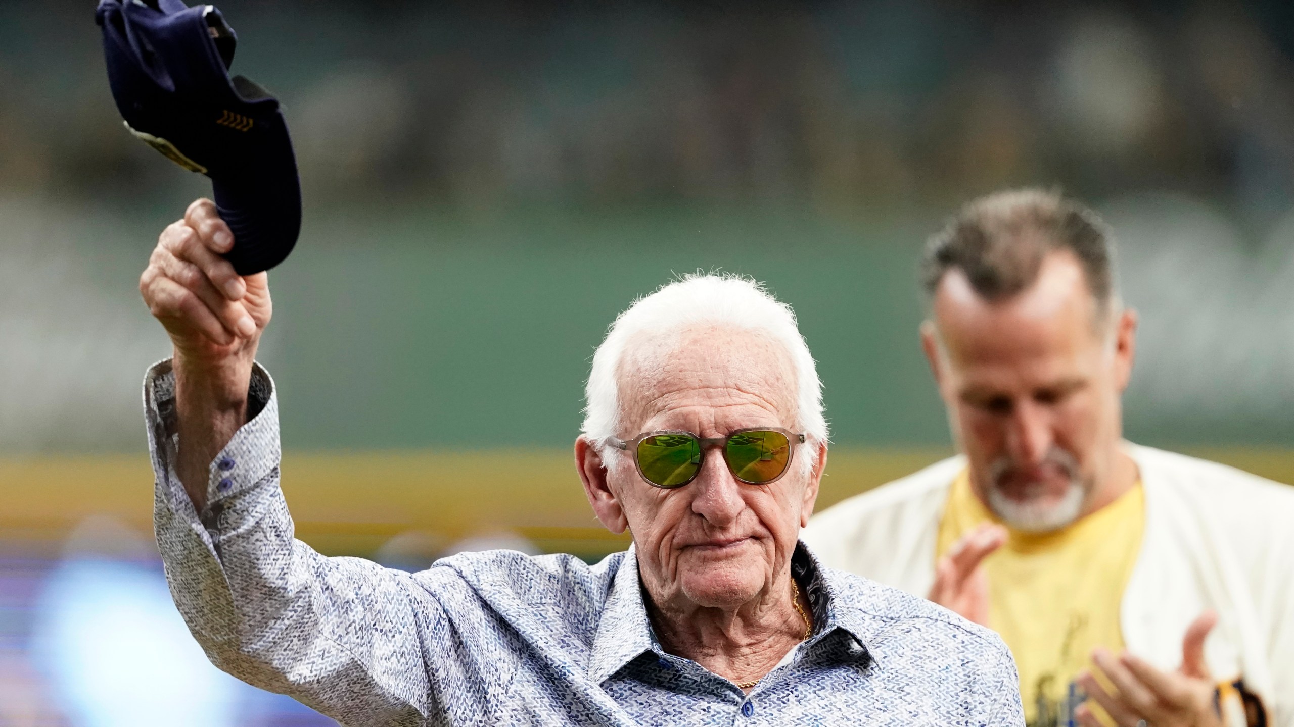 FILE - Milwaukee Brewers radio announcer Bob Uecker tips his cap before a baseball game between the Milwaukee Brewers and the Miami Marlins,, July 28, 2024, in Milwaukee. (AP Photo/Aaron Gash)