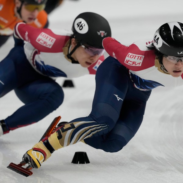 Japan's Kosey Hayashi leads South Korea's Sungwoo Jang during the men's 1500 meters final of the ISU Short Track World Tour and Olympics Milano-Cortina 2026 test event, in Milan, Italy, Saturday, Feb. 15, 2025. (AP Photo/Luca Bruno)