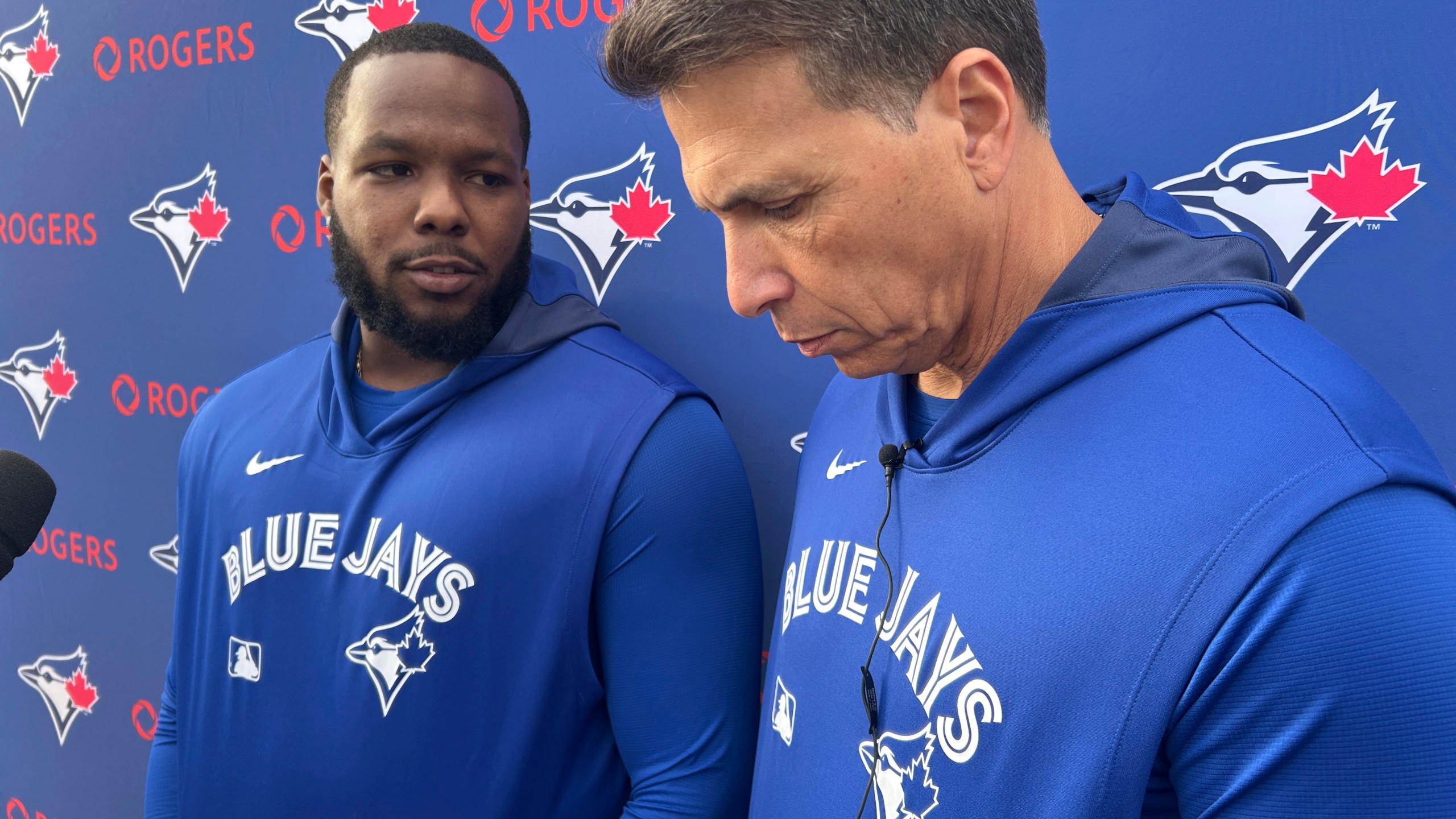 Toronto Blue Jays' Vladimir Guerrero Jr. talks to media in Dunedin, Fla. on Tuesday, Feb. 18, 2025 as interpreter Hector Lebron looks on. Guerrero Jr. told reporters in Dunedin, Fla. that he and the team have not reached an agreement on a contract extension. (Greg Strong/The Canadian Press via AP)