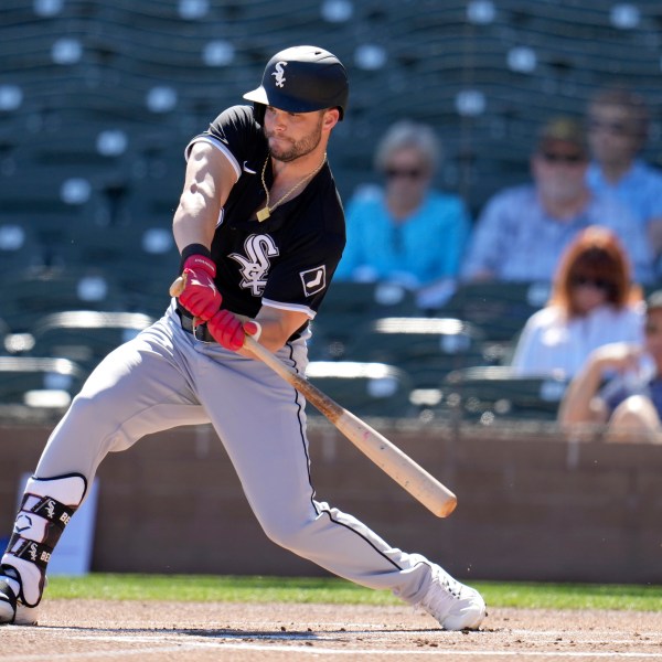 FILE - Chicago White Sox's Andrew Benintendi checks his swing during the first inning of a spring training baseball game against the Colorado Rockies, Tuesday, Feb. 25, 2025, in Scottsdale, Ariz. (AP Photo/Ross D. Franklin, File)