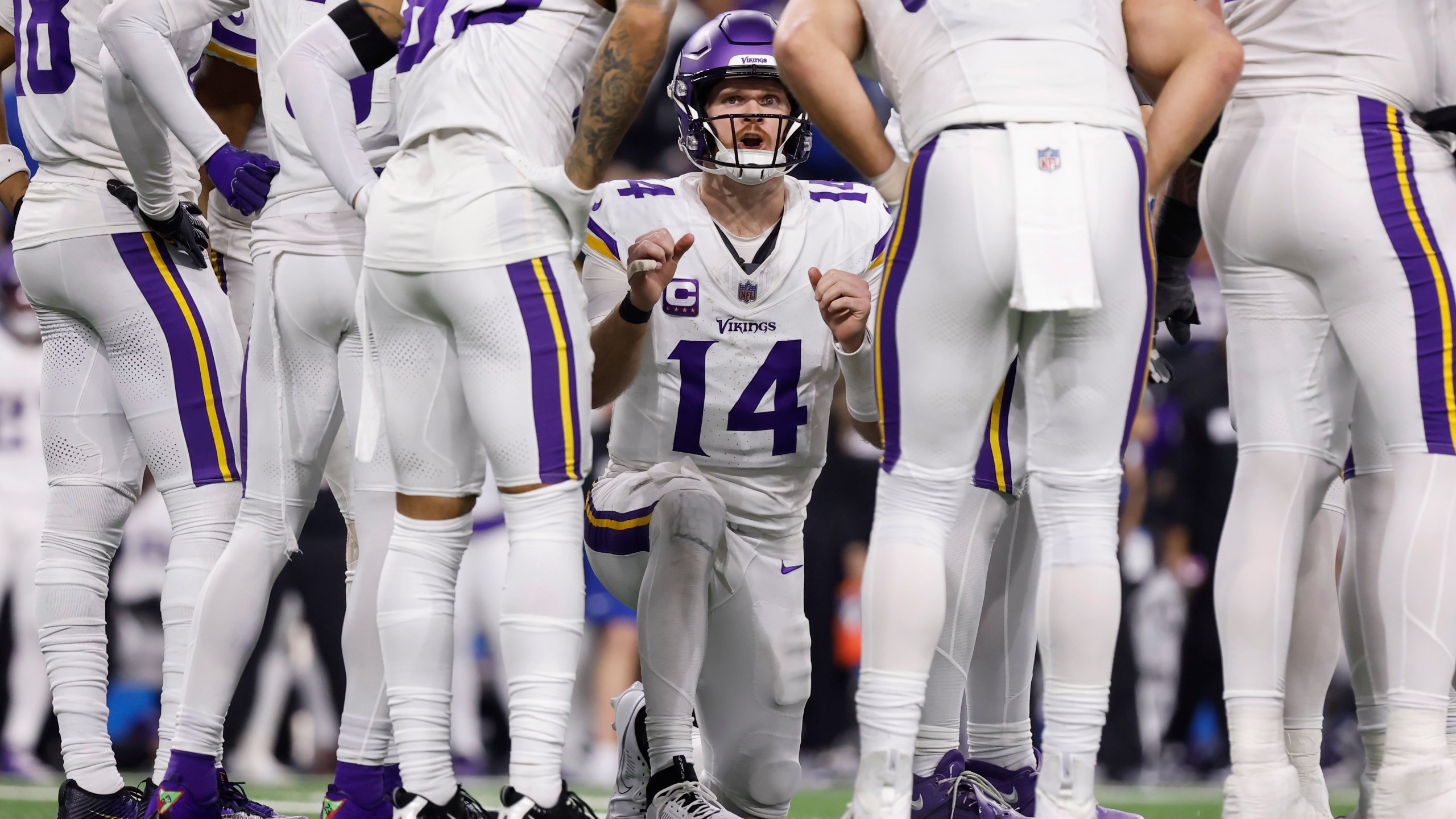 FILE - Minnesota Vikings quarterback Sam Darnold (14) calls a play in a huddle during the second half of an NFL football game against the Detroit Lions, Sunday, Jan. 5, 2025, in Detroit. (AP Photo/Rey Del Rio, File)