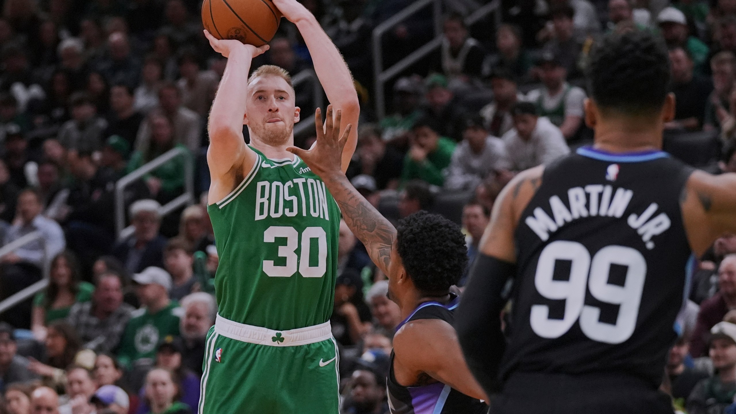 Boston Celtics forward Sam Hauser (30) takes a 3-point shot against the Utah Jazz during the second half of an NBA basketball game, Monday, March 10, 2025, in Boston. (AP Photo/Charles Krupa)