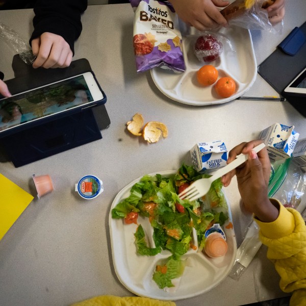 FILE - Seventh graders sit together in the cafeteria during their lunch break at a public school, Friday, Feb. 10, 2023, in the Brooklyn borough of New York. (AP Photo/Wong Maye-E, File)